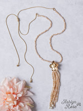 Load image into Gallery viewer, IMPRESS ME GOLD FLOWER TASSEL PENDANT ON A ROSY TAN CRYSTAL BEADED NECKLACE
