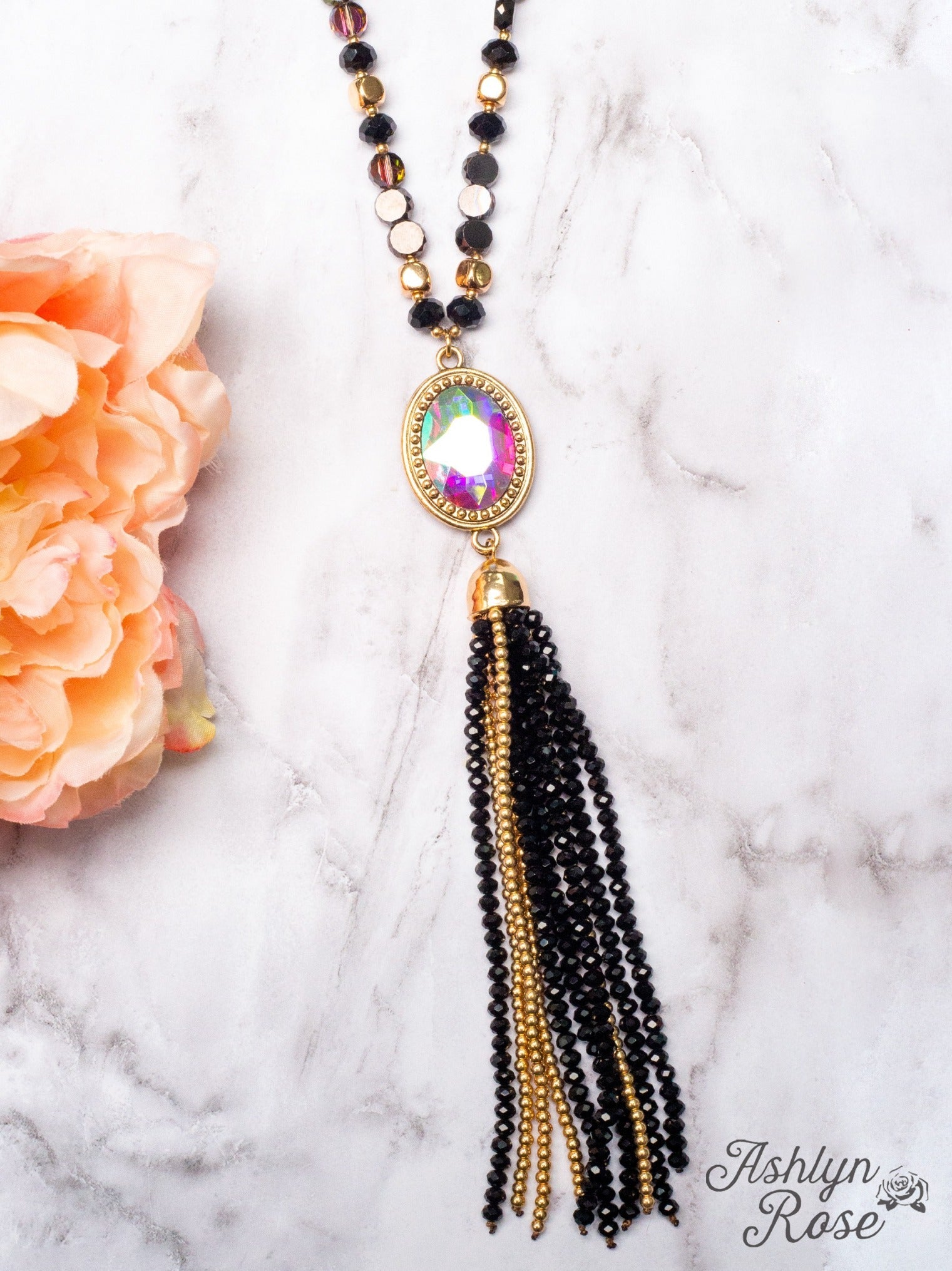 CRASH MY PARTY OVAL IRIDESCENT CRYSTAL BEADED TASSEL PENDANT ON A CRYSTAL BEADED GOLD LINKED CHAIN NECKLACE, BLACK